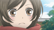 a close up of a girl 's face with big eyes