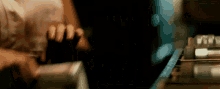 a blurry picture of a person 's hands holding something