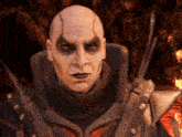 a bald man in a black and red costume with a sword in his hand