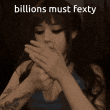 a woman smoking a cigarette with the words billions must fexty written above her