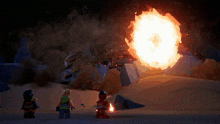 a group of lego figures standing in front of a large fireball
