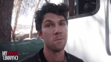 a man is standing in front of a white trailer with the words mydamn channel written on the bottom