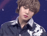 a close up of a person wearing a black jacket
