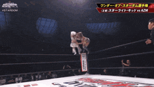 a wrestling match between azm and stardom is going on