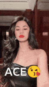 a woman is wearing a black strapless top with ace written on the front