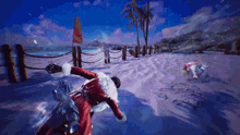 a man in a santa suit is riding a bike on a beach