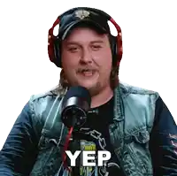 a man wearing headphones and a hat says yep