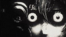 a black and white photo of a person 's face with the letters fbi visible
