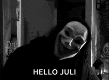 a black and white photo of a person wearing a mask with the words `` hello juli '' written below it .