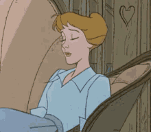 a cartoon character is sleeping in a chair with her eyes closed .