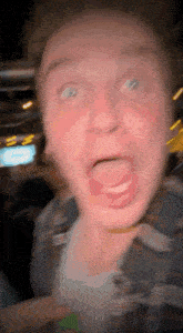 a blurry picture of a person making a funny face