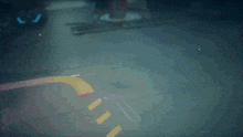 a blurry image of a person holding a sword with the letter a on it