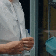 a close up of a person wearing a lab coat