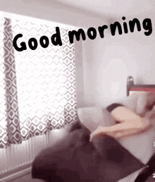 a picture of a person laying on a bed with the words " good morning " written above them