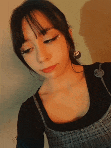 a close up of a woman 's face with a black shirt on