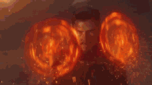 a large explosion with a lot of flames and sparks coming out of it .