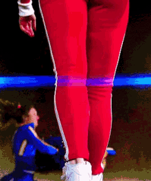 a pixelated image of a cheerleader with the number 11 on her jersey