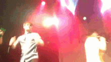 a blurry photo of a group of people on stage