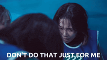 a girl in a blue vest with the number 22 on it