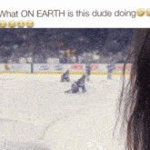 a blurred image of a hockey game with the words what on earth is this dude doing below it