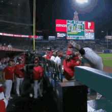 a scoreboard at a baseball game shows that the angels are leading the new york yankees