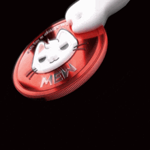 a red coin with a face on it that says ' empire '