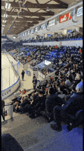 a hockey stadium filled with people and a sign that says guru on it