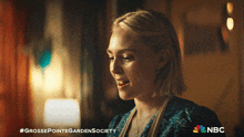 a nbc ad for grosse pointe garden society shows a woman in a blue dress