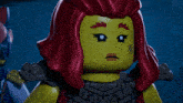 a lego figure with red hair and a x on her face