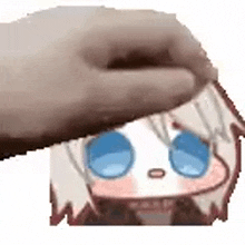 a hand is touching a cartoon character 's face with its thumb .