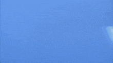 two fighter jets are flying in a blue sky and one of them has the letter k on it