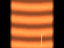 a row of orange lines on a black background .