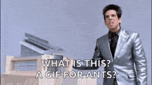 a man in a suit is standing in front of a building and asking what is this ? a gif for ants .