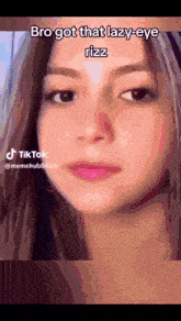 a close up of a woman 's face with the words bro got that lazy eye rizz
