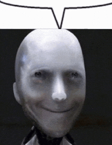 a bald robot is smiling with a speech bubble above it