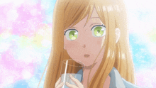 a girl with blonde hair and green eyes is drinking a glass of water