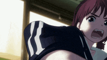 a girl with red hair is wearing a black shirt with white stripes on it