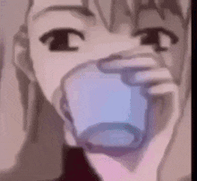 a close up of a person drinking out of a glass .