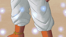 a cartoon character with a yellow sleeve and white pants is standing in the sand