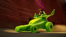 a cartoon character is riding a green vehicle