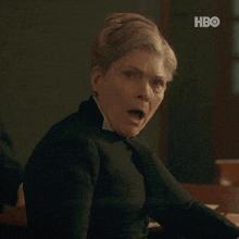 a woman with a surprised look on her face is shown in a hbo ad
