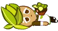 a cookie from a video game is laying on the ground with a plant in his mouth .