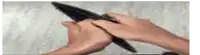 a person is holding an empty wallet with their hands .