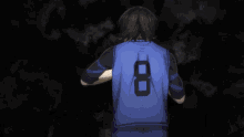 a man in a blue shirt is pointing at something