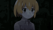 a girl covering her face with her hands in a dark forest