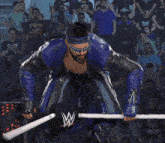 a man in a blue and black costume with a shark mask