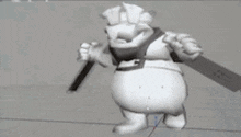 a 3d model of a cartoon character holding a sword and a hammer .