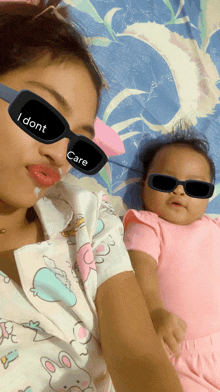 a woman wearing sunglasses that say i dont care