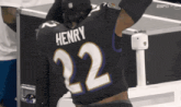 a football player with the name henry on the back of his shirt
