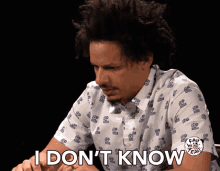a man wearing a shirt that says i don t know